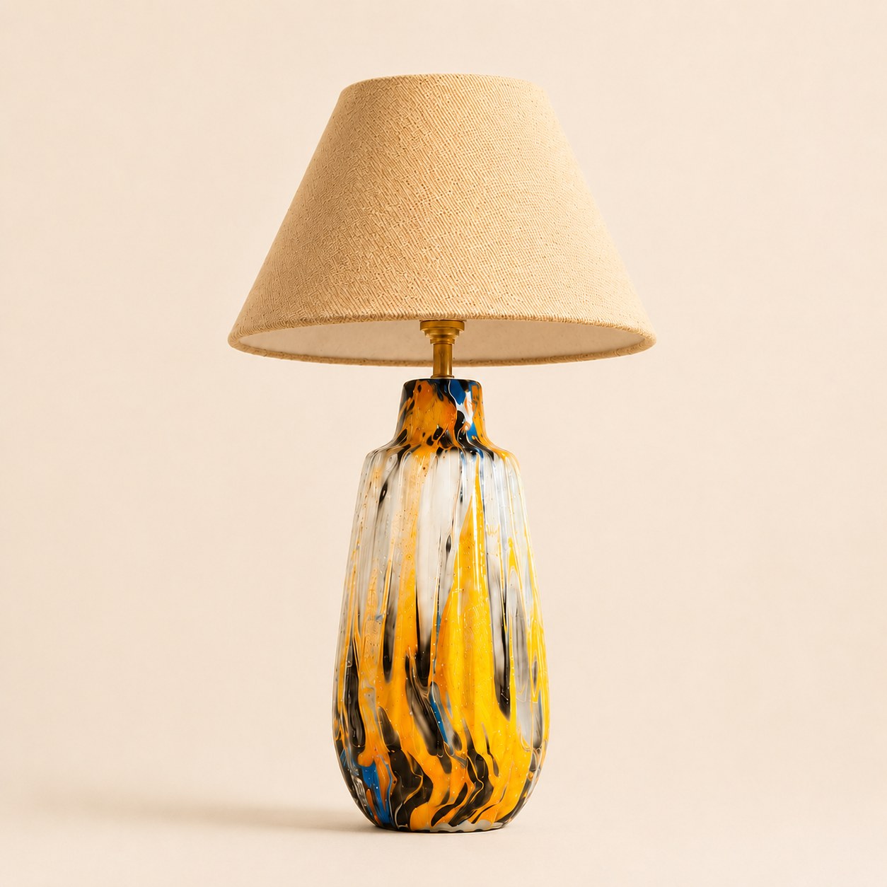Marbled ceramic table lamp with beige textured shade and hand-finished ceramic base, main studio product photo